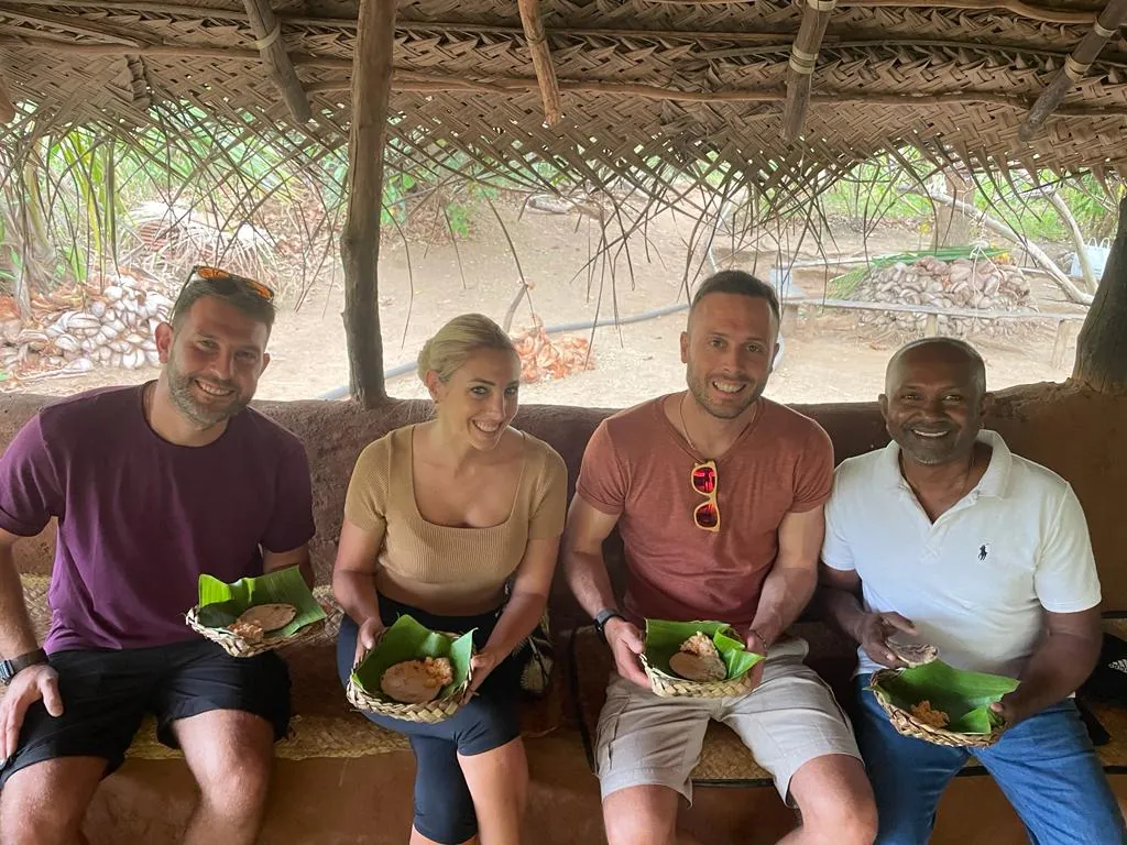 Tour guide Romesh and guests sample local cuisine on a food safari in Sri Lanka.