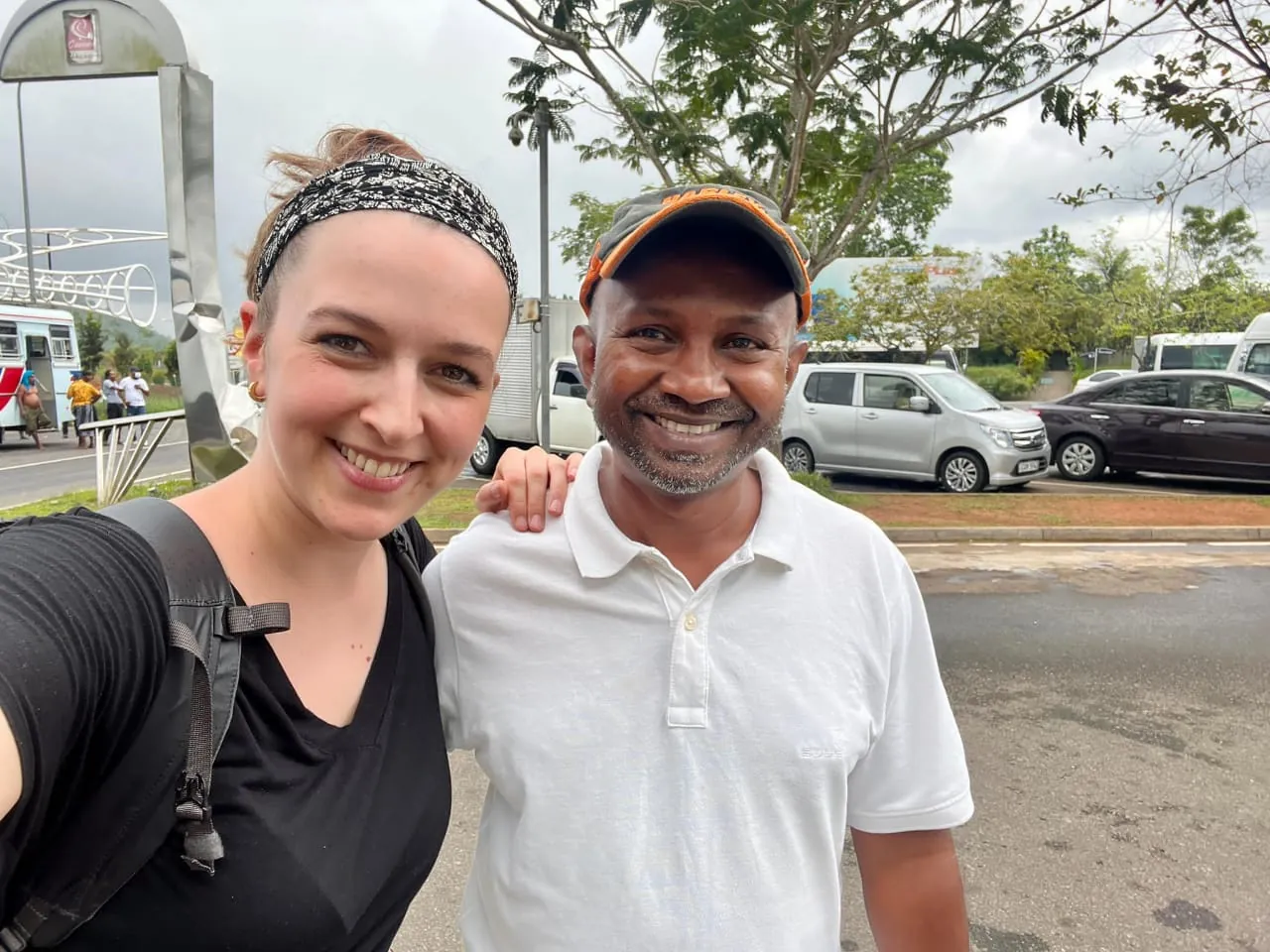 A female tourist takes a selfie with tour guide Romesh during a tour of Sri Lanka.